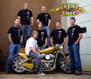 Michael Prugh, of Prugh Design is shown with students and instructors from the 2010 Western Dakota Technical Institute's Welding, Manufacturing and Collision Repair with the 2010 Buffalo Chip Challenge bike, named 