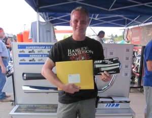 Kevin Roark was the lucky winner of the Free SuperTrapp Exhaust Giveaway at Bike Nite in Sheffield, Ohio. He is replacing the Bassanis on his 2006 Night Train with SuperTrapp’s Road Legends Black Crack Pipes. 